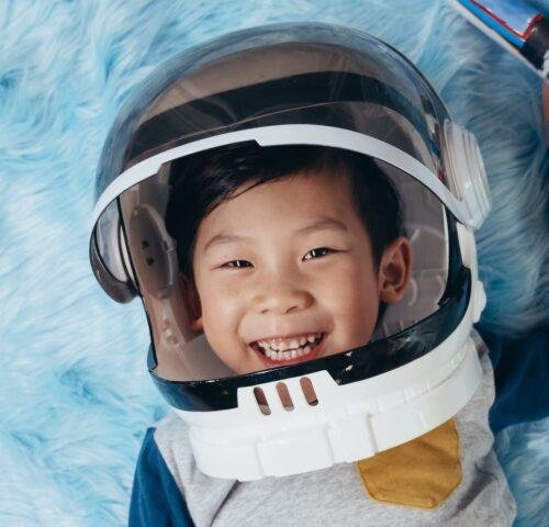 a boy smiling at the camera