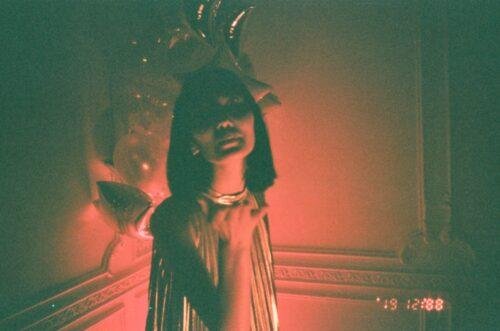 woman standing while making flying kiss